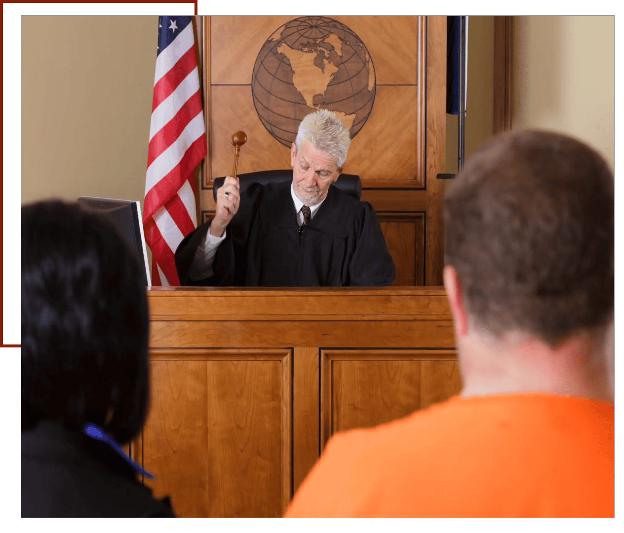 Judge holding gavel in courtroom
