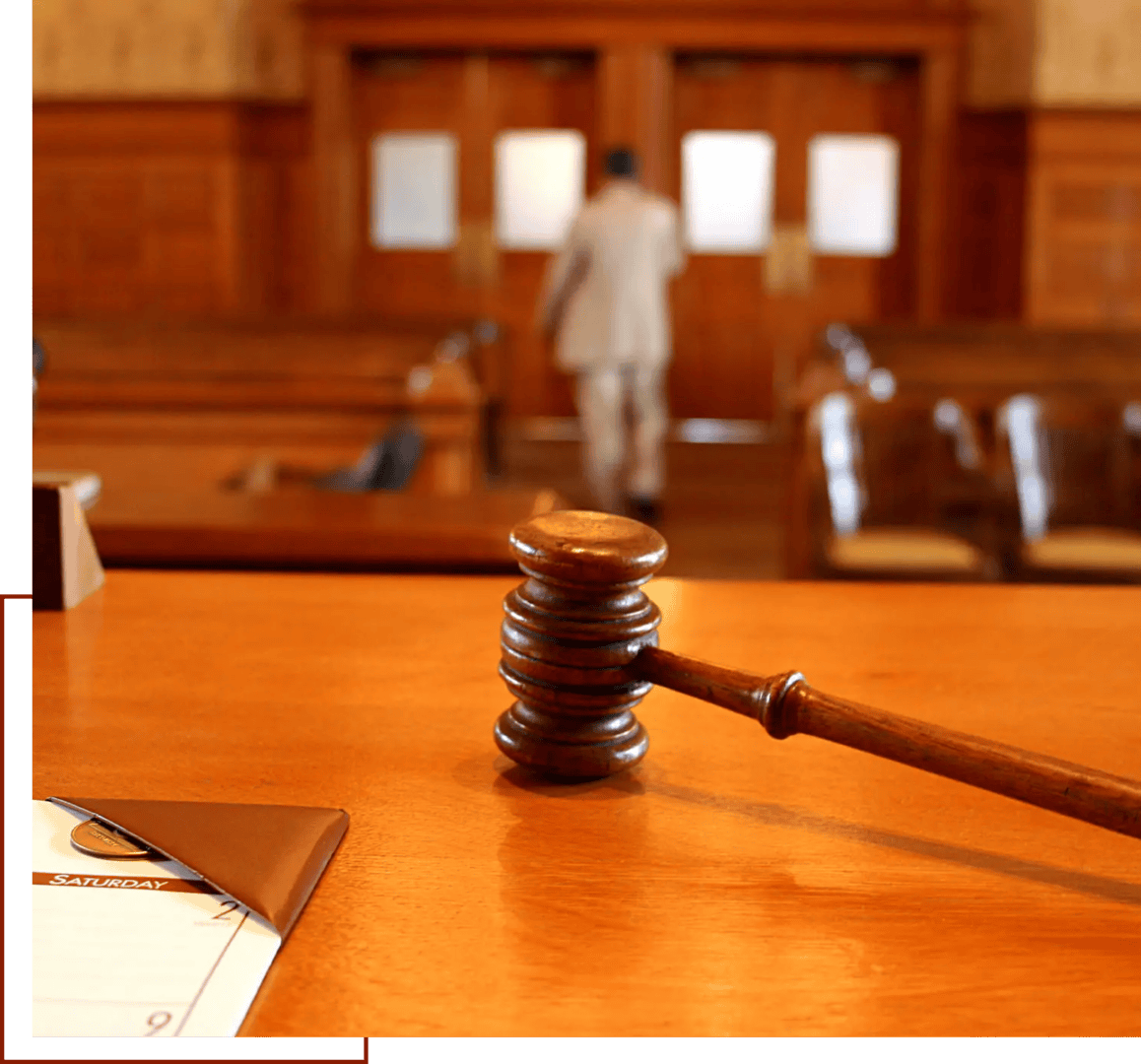 Gavel on courtroom desk with blurred background