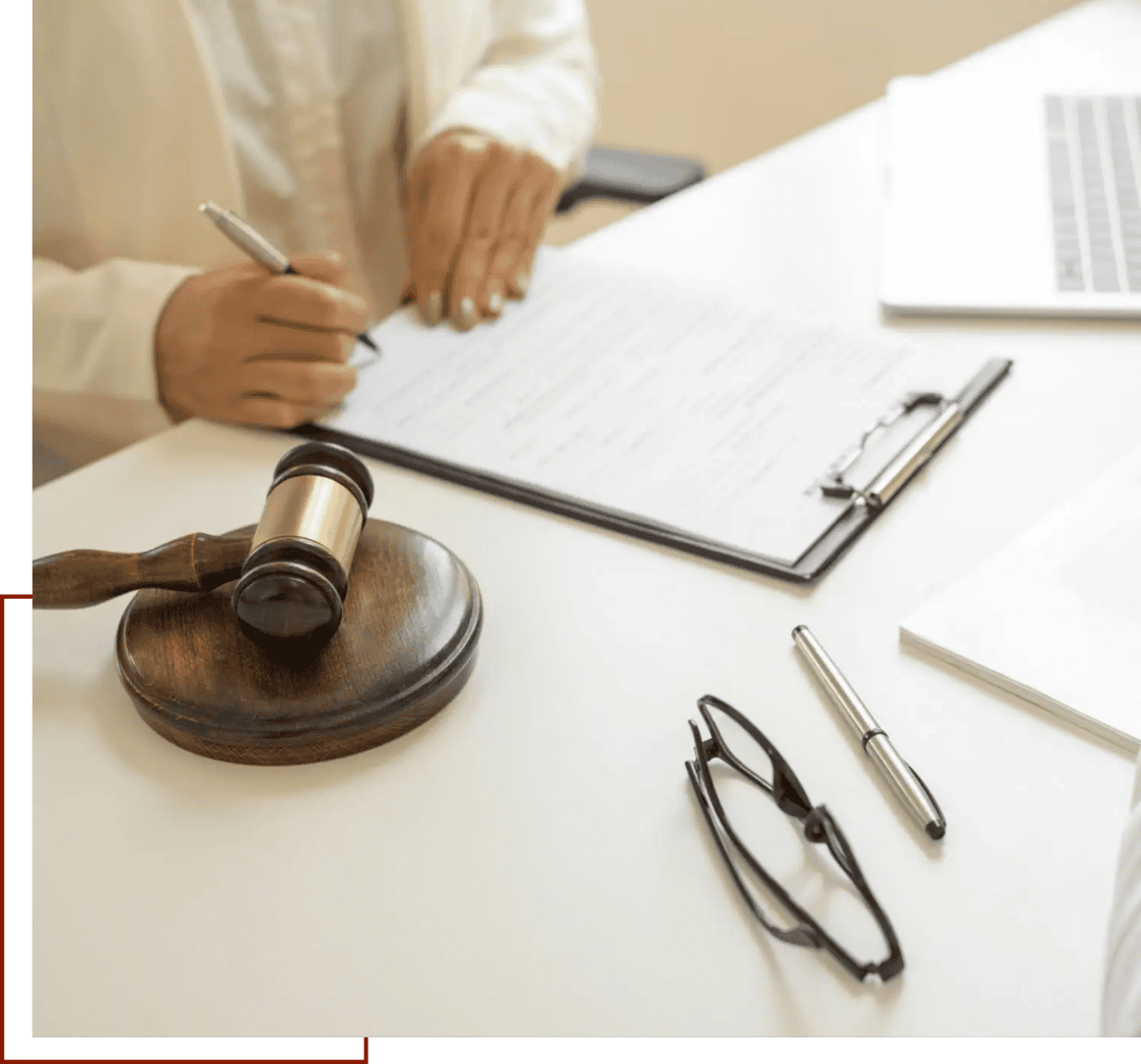 Attorney's workspace with glasses and pen