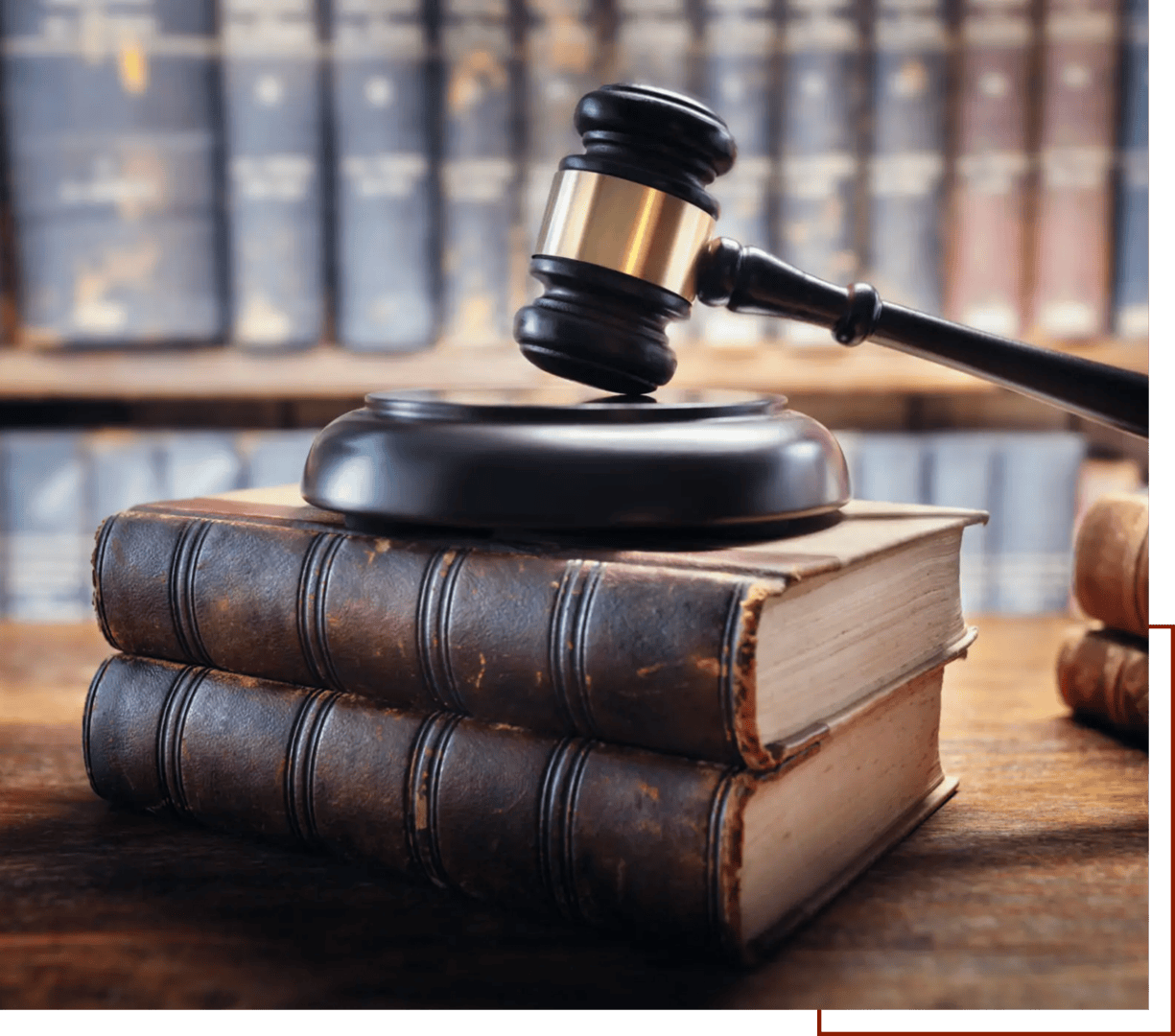 Legal books with a gavel on top