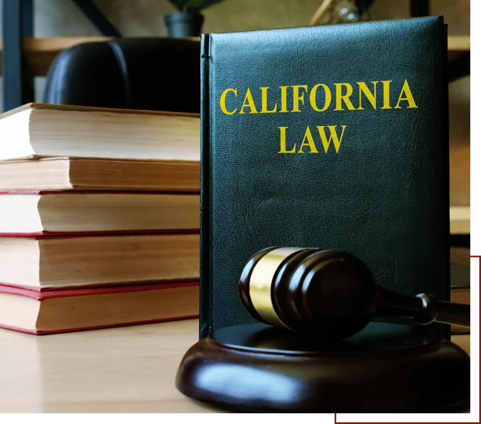 Table with a California law book and a gavel on top of it, surrounded by books