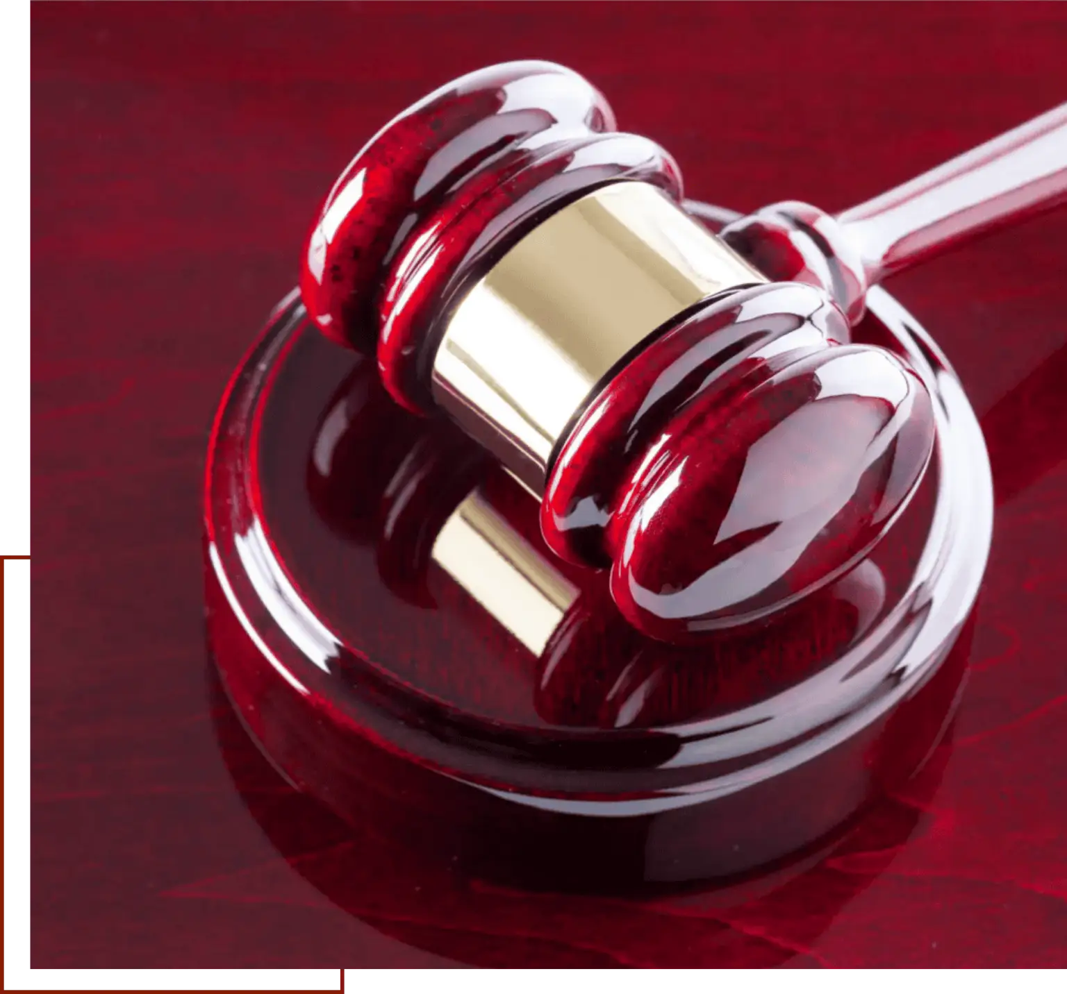 Red gavel on polished surface